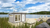 Bastu i vit och grå panel med glasdörr och veranda med sittplatser
